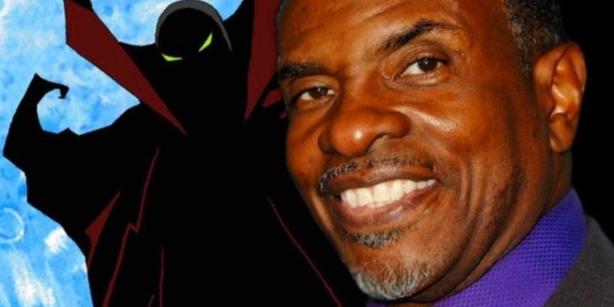 Voice actor Keith David smiling beside a picture of Spawn from the HBO animated series of the same name