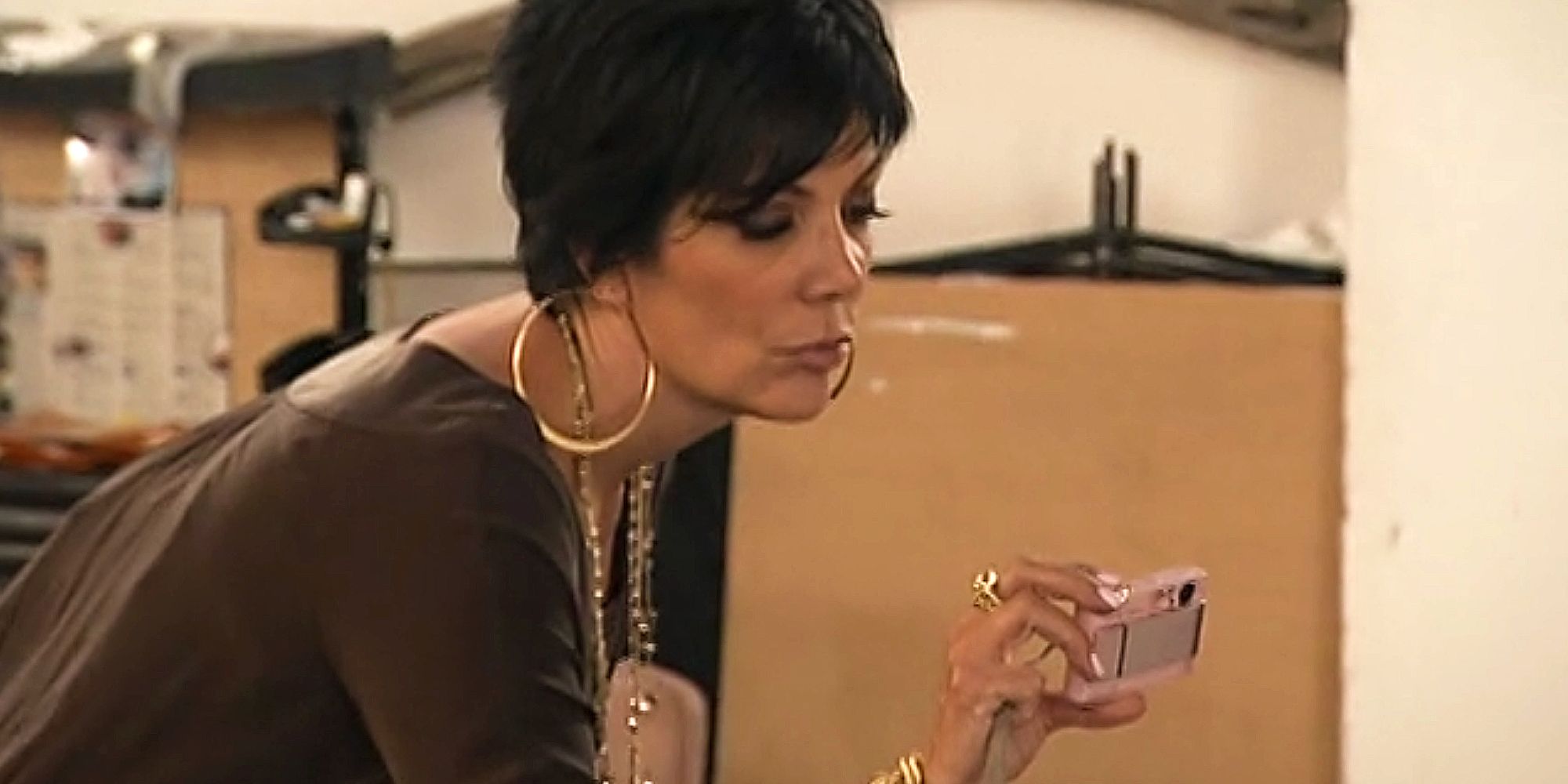 Kris Jenner holding a digital camera, sweetie, on Keeping Up With The Kardashians