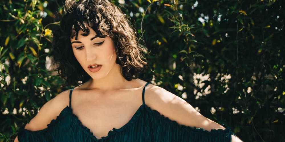 Love is Blind star Danielle Drouin poses outdoors in front of trees