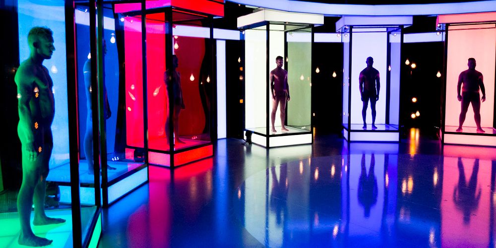 Contestants pose nude in colored boxes on Naked Attraction