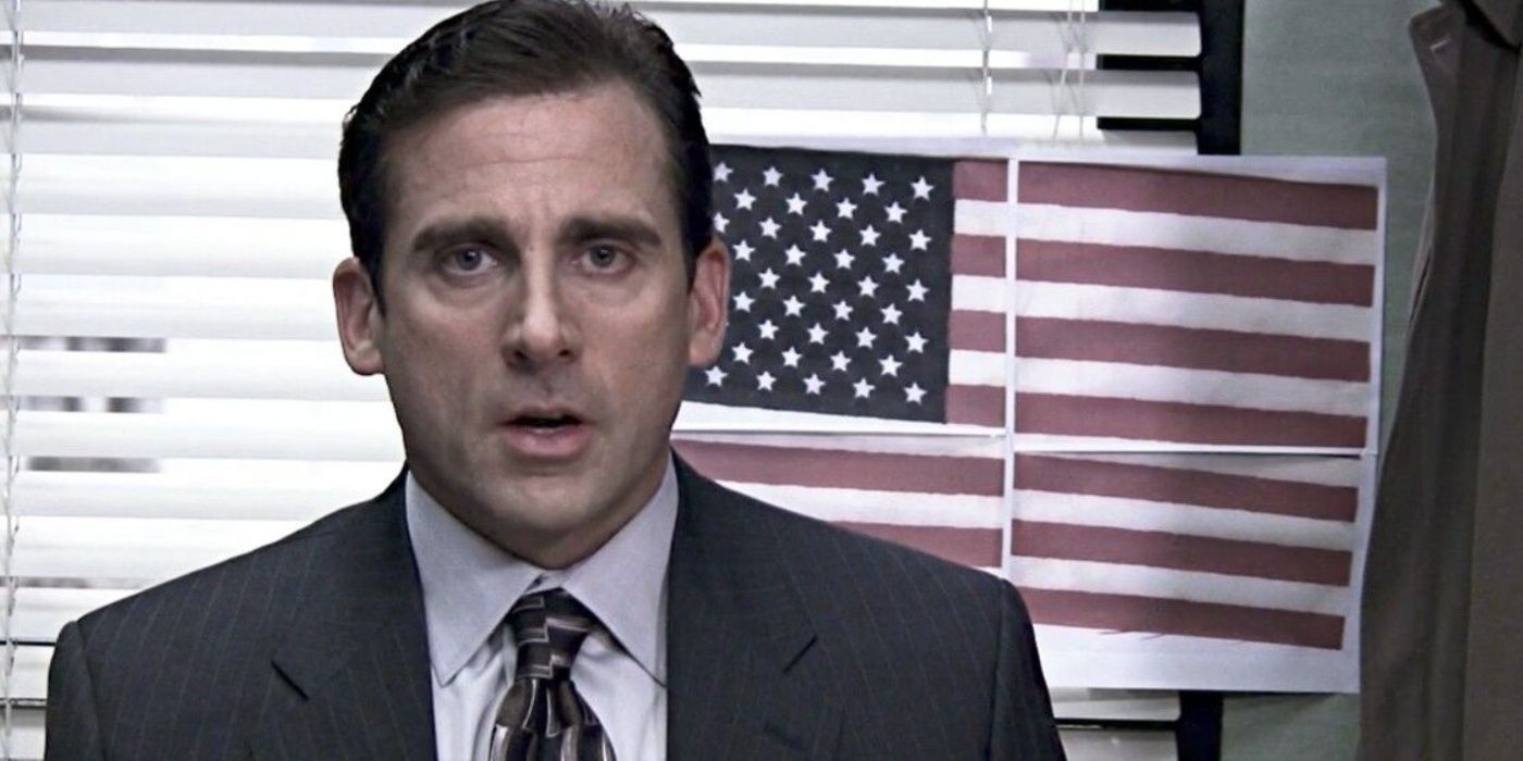 Michael in front of a paper American flag in The Office