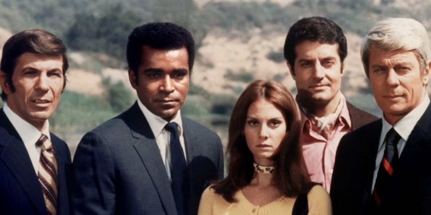 The cast of the Mission Impossible TV series looking at the camera.