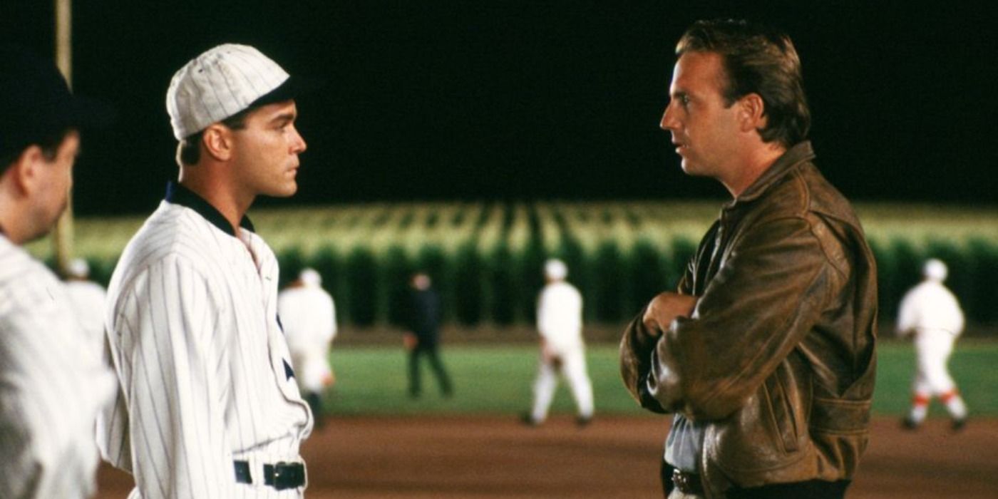 Ray Kinsella (Kevin Costner) talking to Shoeless Joe Jackson (Ray Liotta) on the field in Field of Dreams