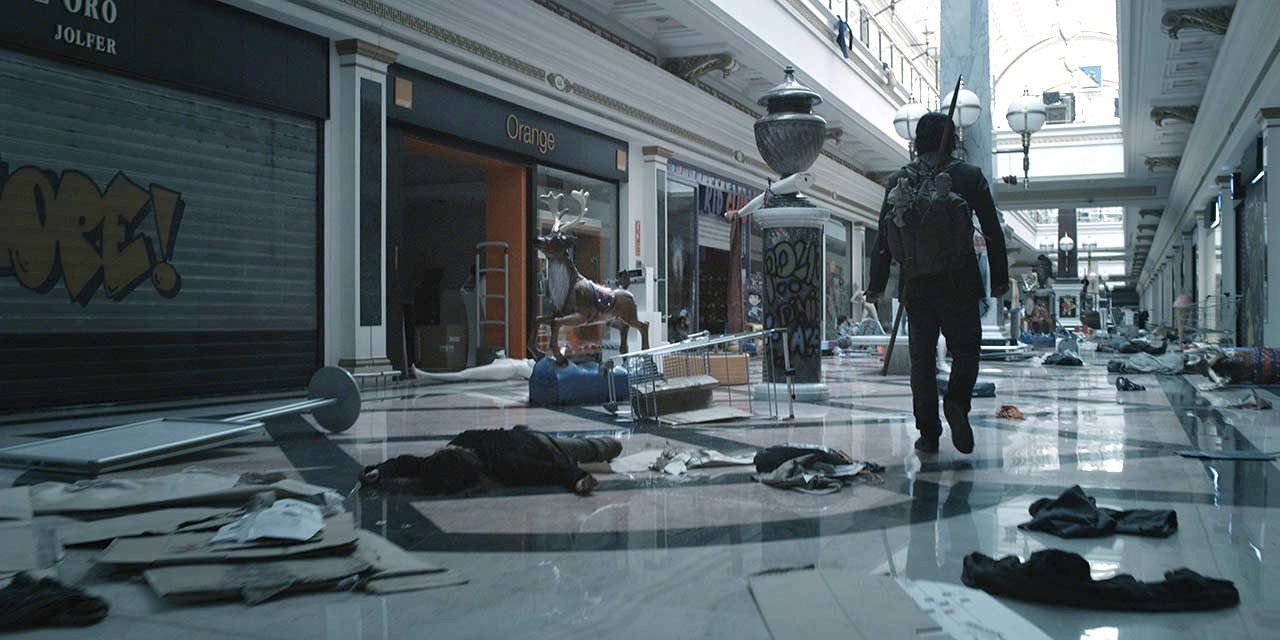 Marc walks through a desolate mall with bodies on the floor in The Last Days.