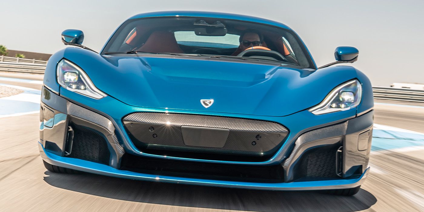 Front view of a Rimac Nevera going down a road.