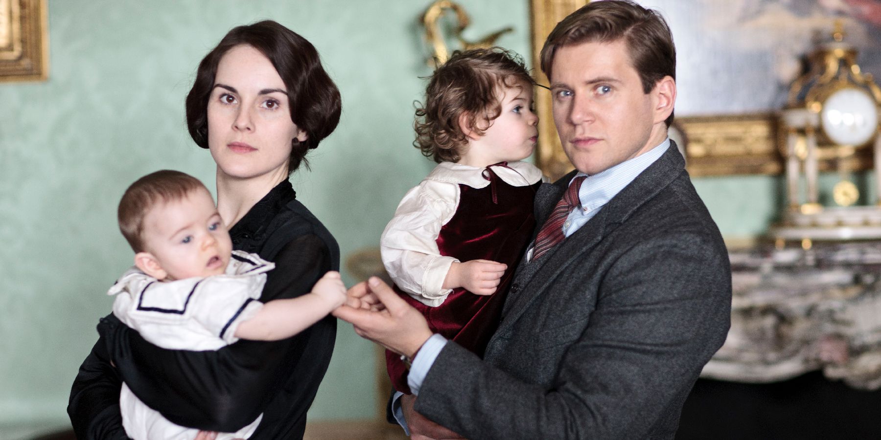 Mary and Tom hold their babies in Downton Abbey.