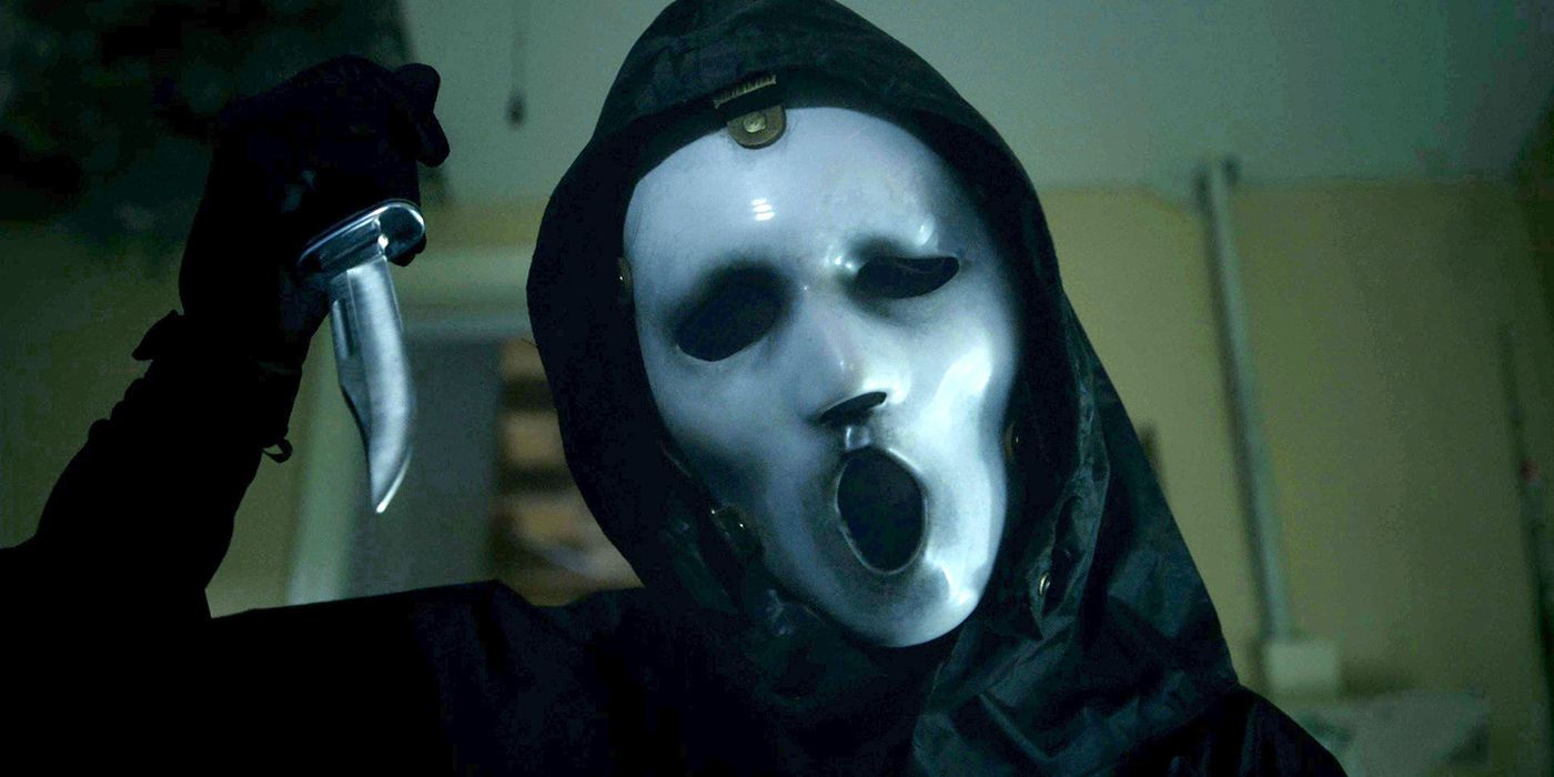 Ghostface from the Scream TV series holding up a knife.