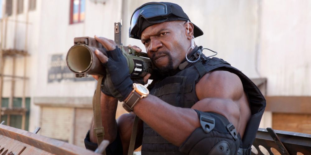 Hale Caesar points rocket launcher at his target in The Expendables