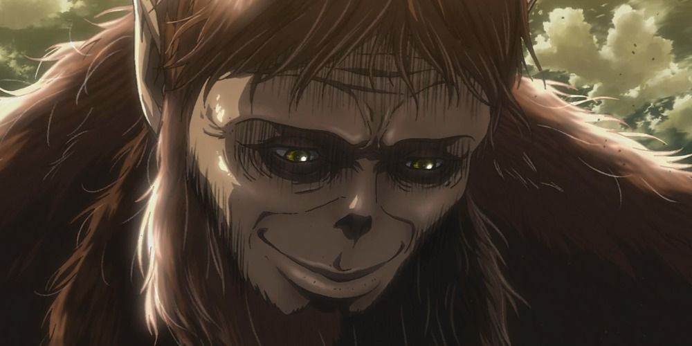 the Beast Titan from Attack on Titan smiling coldly down at a captured soldier