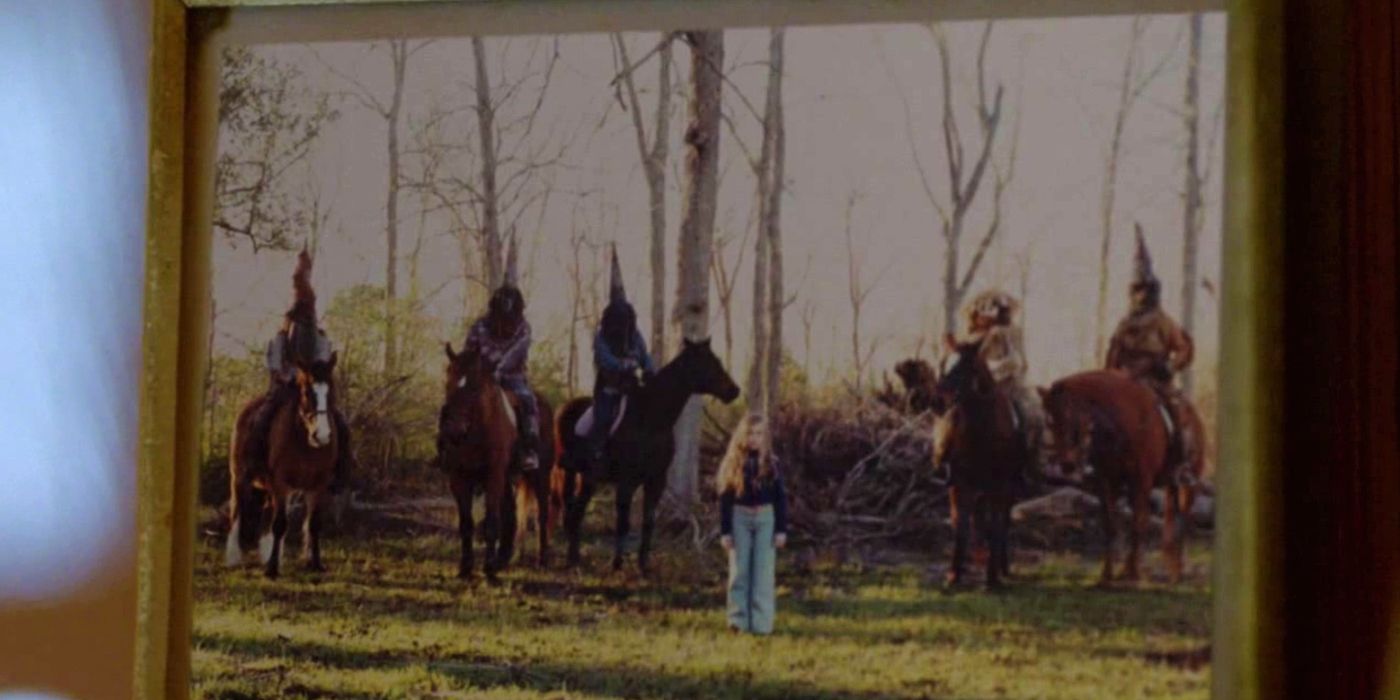A photo of a woman surrounded by hooded men on horses in True Detective season 1