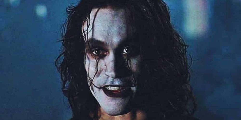 the main character of The Crow smiling in full makeup