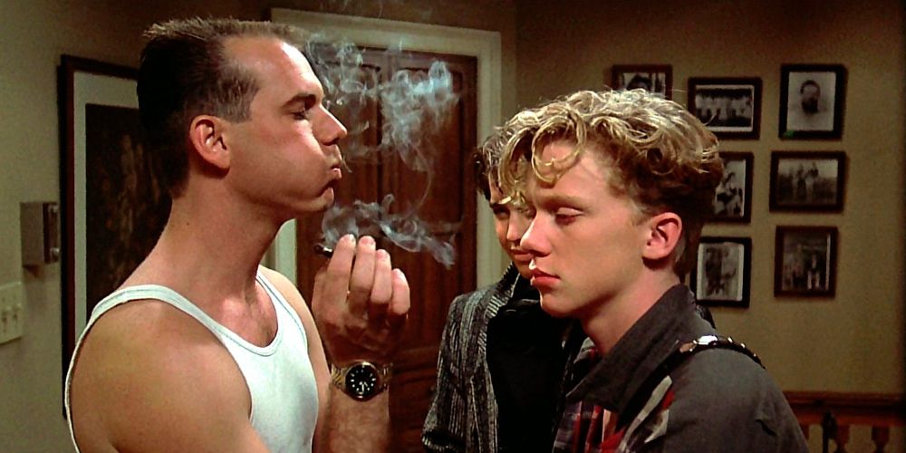 Chet blows cigar smoke in Wyatt and Gary's face in Weird Science