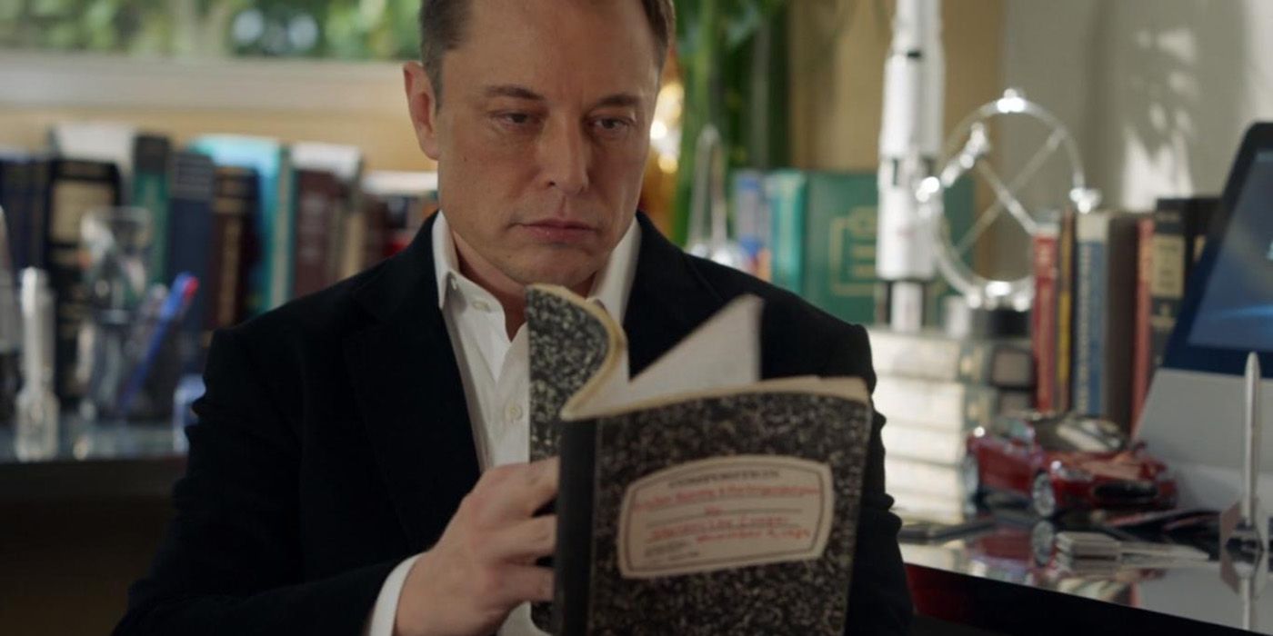 Elon Musk looking at Sheldon's book of theories in a flash forward scene from Young Sheldon.