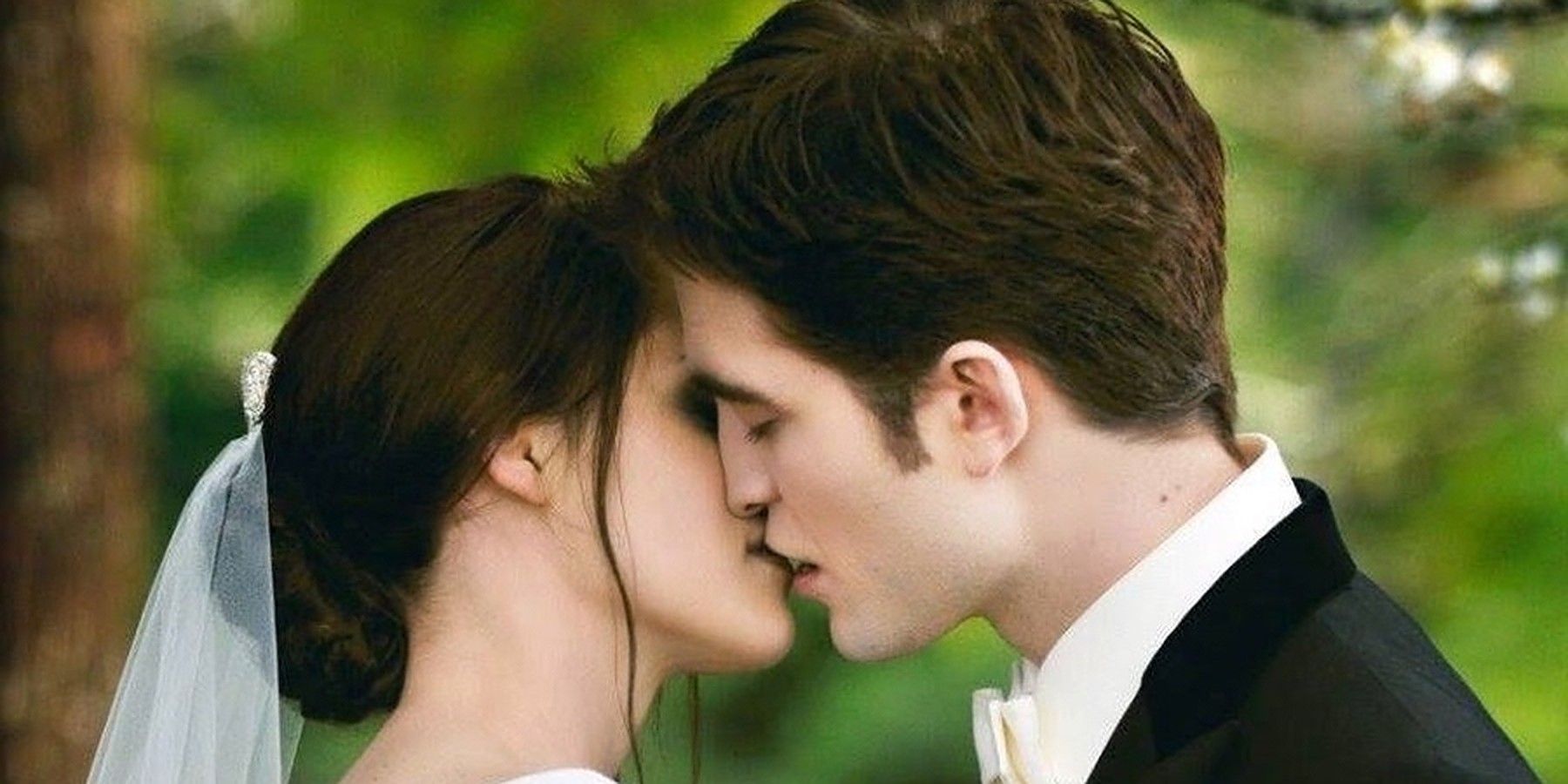 Bella and Edward kiss in Twilight Breaking Dawn Part 1