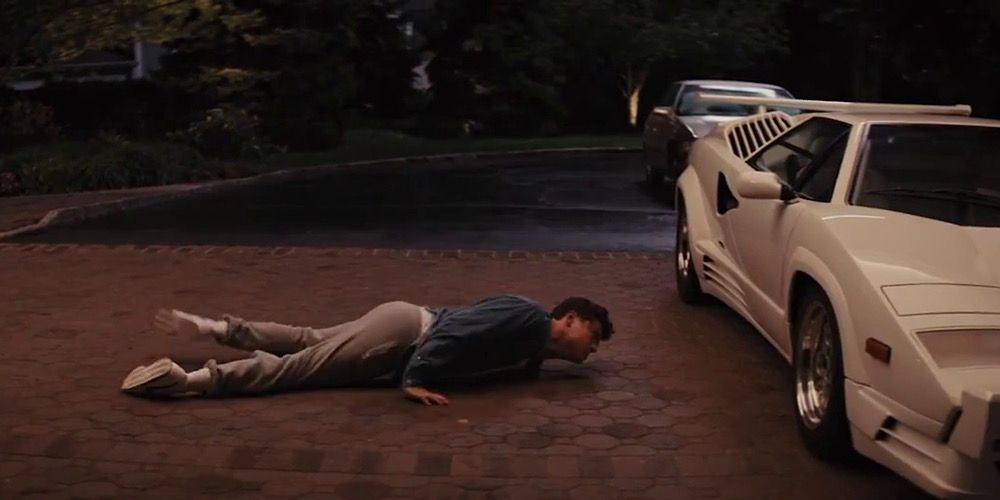 Jordan Belfort crawls to his car in The Wolf Of Wall Street