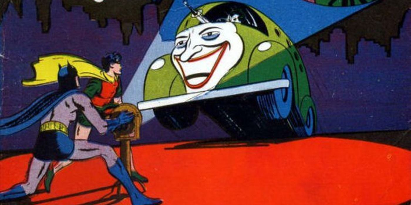 A Joker car rushes at Batman and Robin DC Comics.