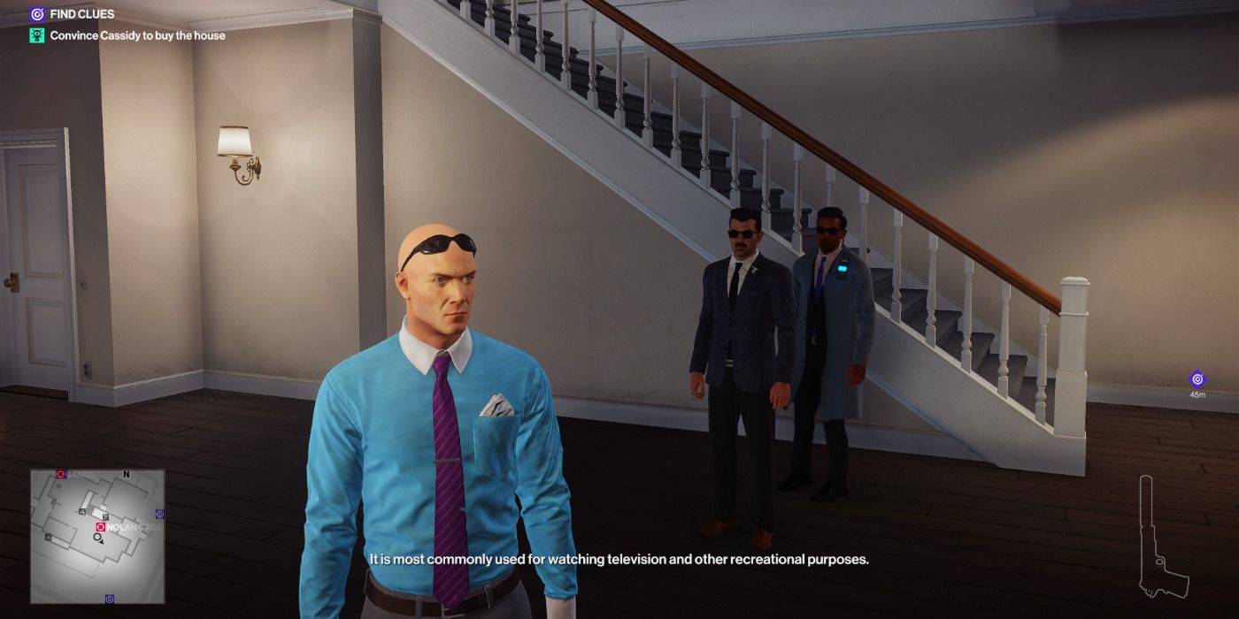 Agent 47 dressed as an estate agent showing the target around the house in Hitman 2