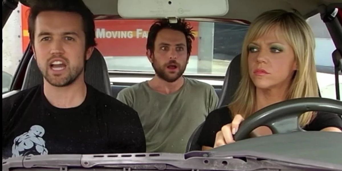Mac, Charlie, and Dee are in a car about to drive in It's Always Sunny in Philadelphia.