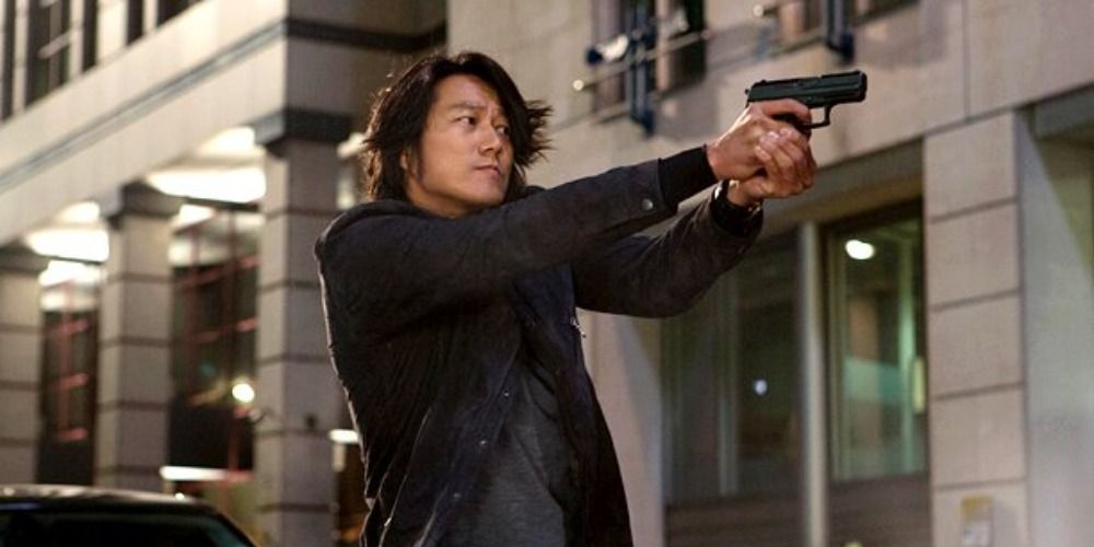 An image of Han firing a gun in Fast and Furious 6