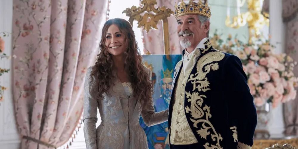King Rowan and Queen Beatrice smile as they talk to their children in Cinderella 2021