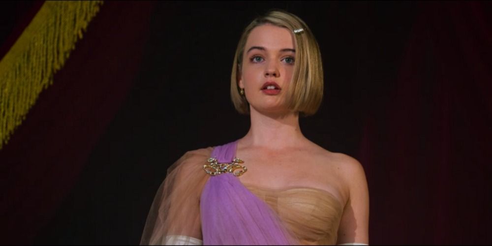 An image of Princess Gwen wearing Cinderella's dress in the 2021 Cinderella movie