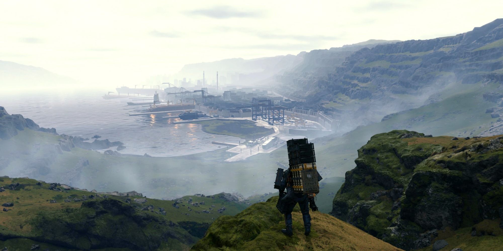 An image of Sam standing on a mountain top in Death Stranding game.