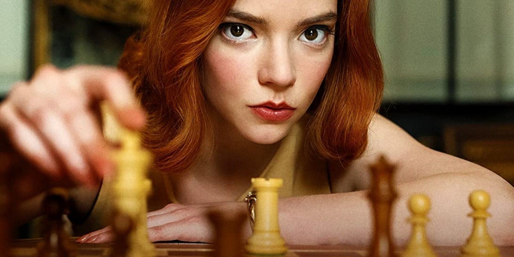 Beth Harmon in front of a chess board in The Queen's Gambit.