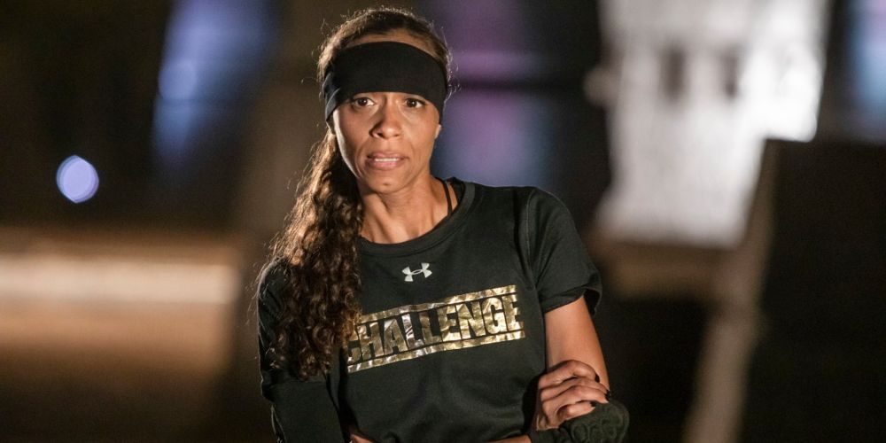 Arissa wears a black headband and a black Challenge shirt for The Challenge promo image