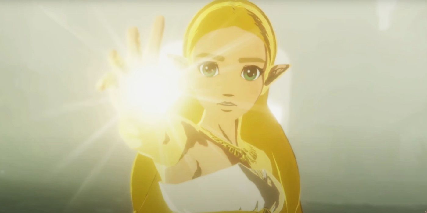 Zelda from Breath of the Wild looking straight into the camera, with her outstretched palm glowing as she calls on her goddess-granted powers.