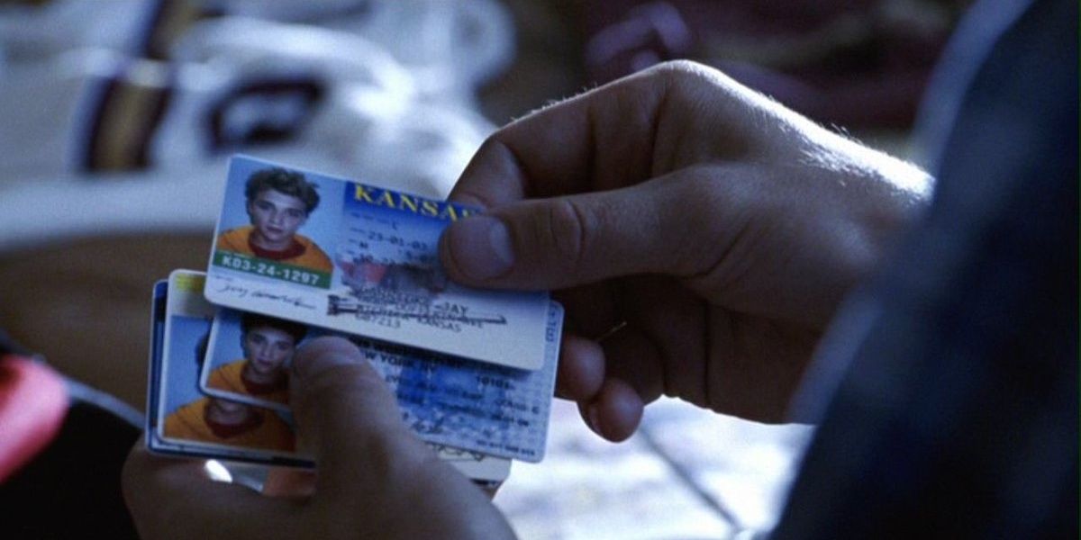 Clark checks out Bart Allen's fake IDs in Smallville