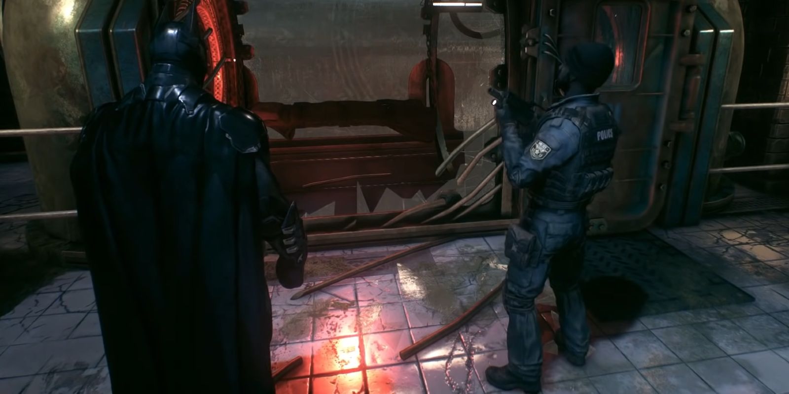 Batman examinando cela de contenção destruída de Man-Bat em Batman: Arkham Knight