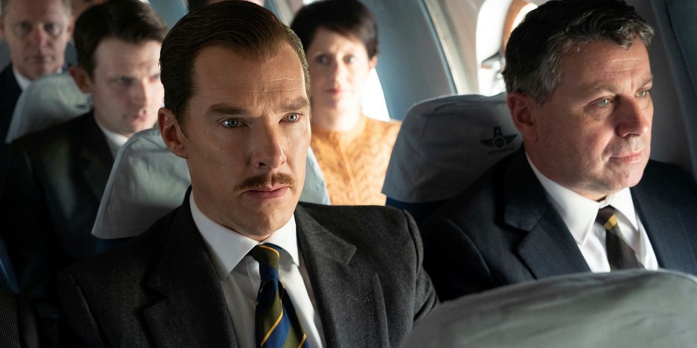 Benedict Cumberbatch sits on a plane in The Courier