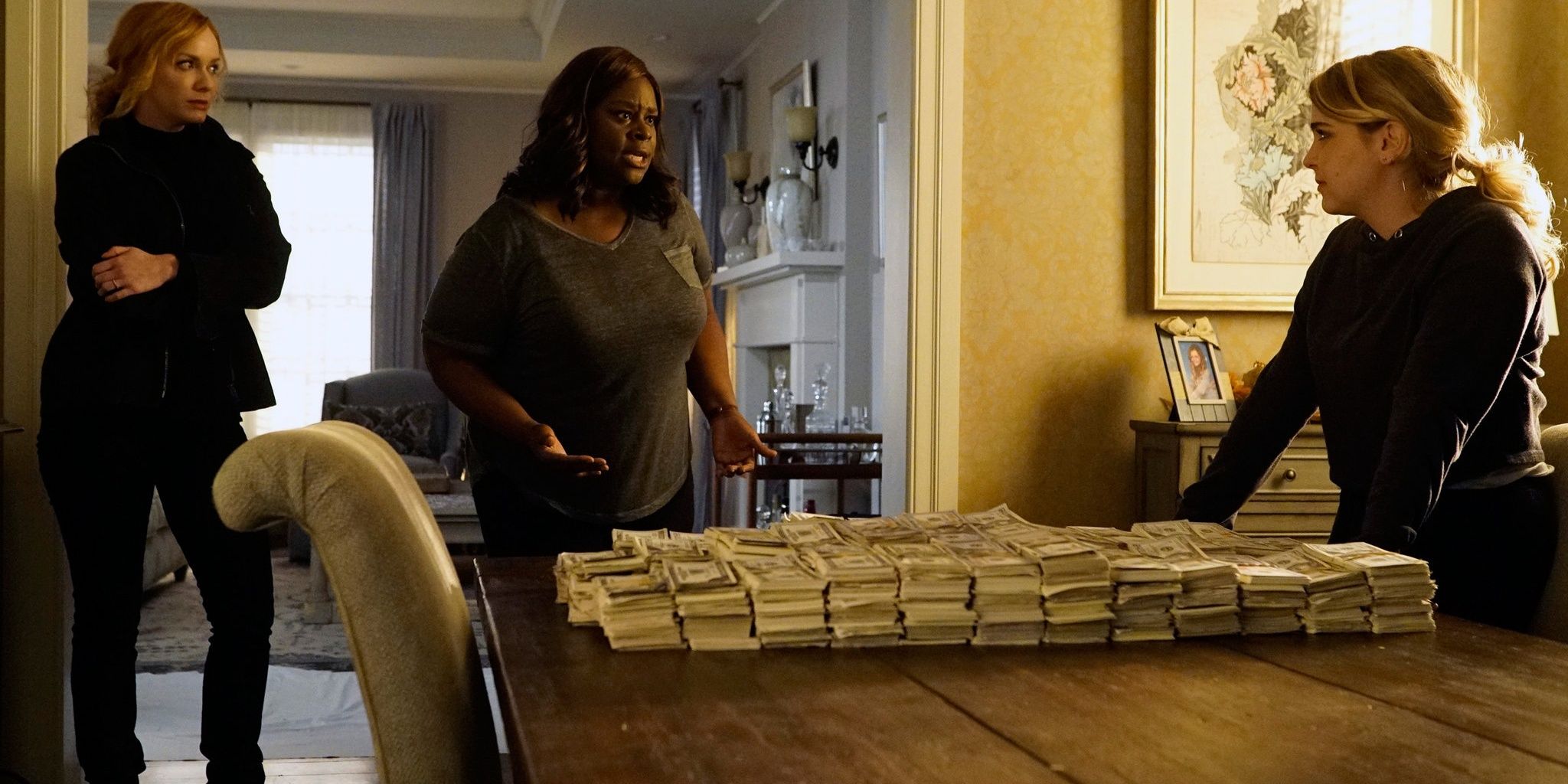 Beth, Ruby and Annie count the counterfeit money they have made in Good Girls