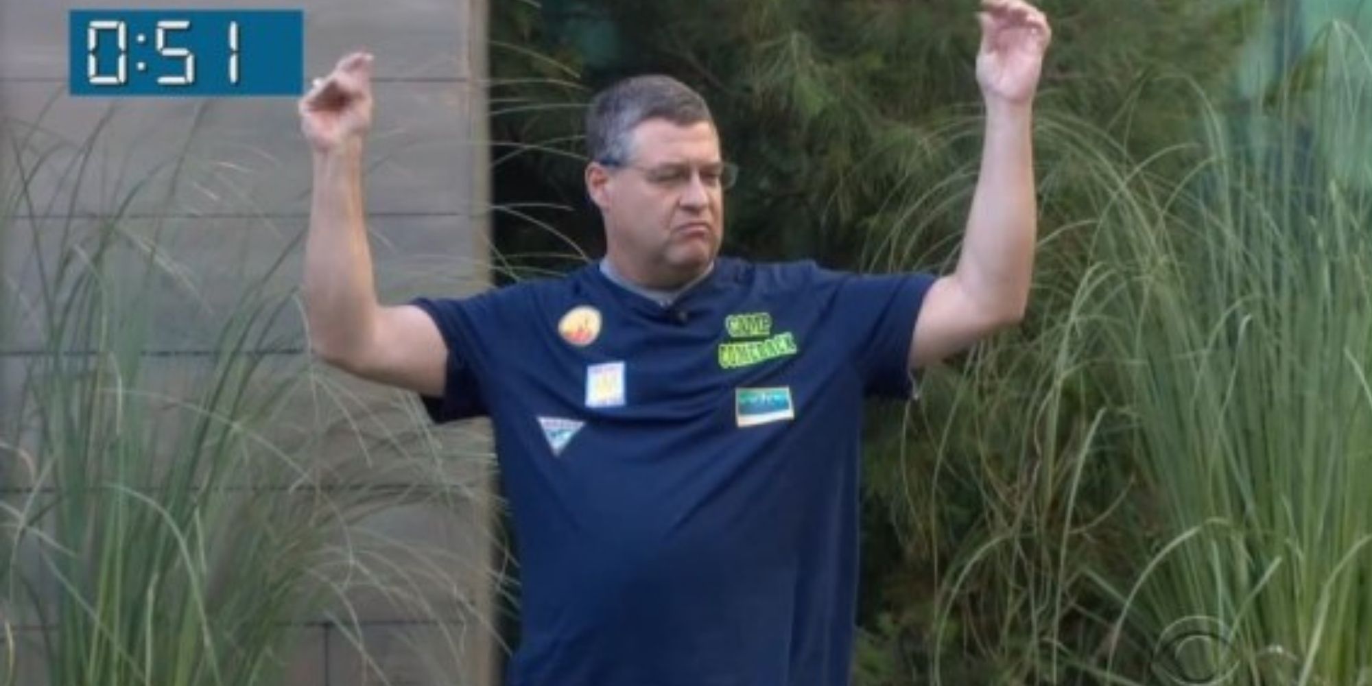 Cliff Hogg raising his arms in celebration in Big Brother