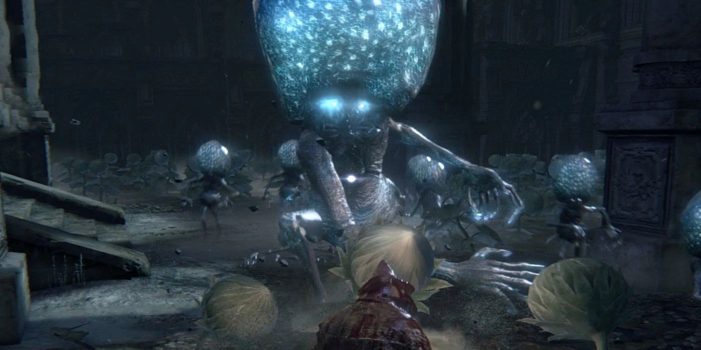 The Celestial Emissary boss fights a hunter in Bloodborne.