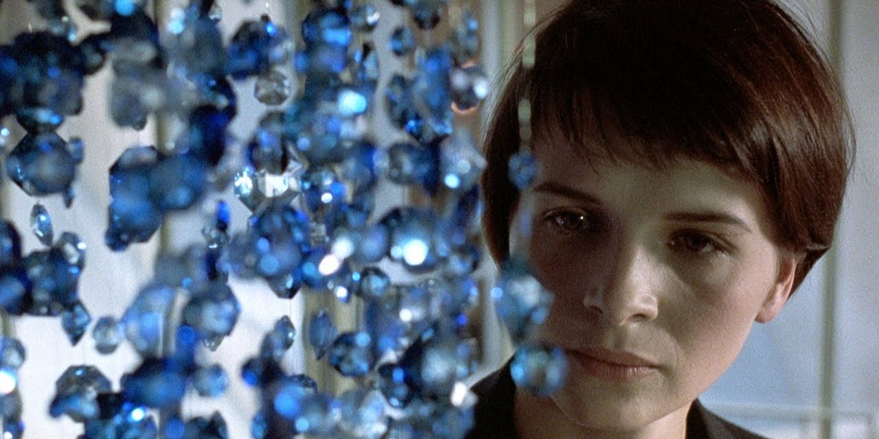 Juliette Binoche looks at blue crystals in the film Blue.