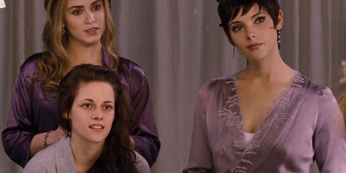 Rosalie, Alice, and Bella look into a mirror as Bella gets ready for her wedding in Breaking Dawn.