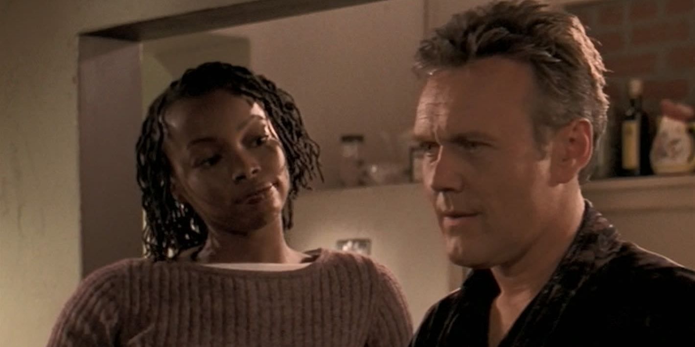 Olivia and Giles in Giles' apartment in Buffy the Vampire Slayer