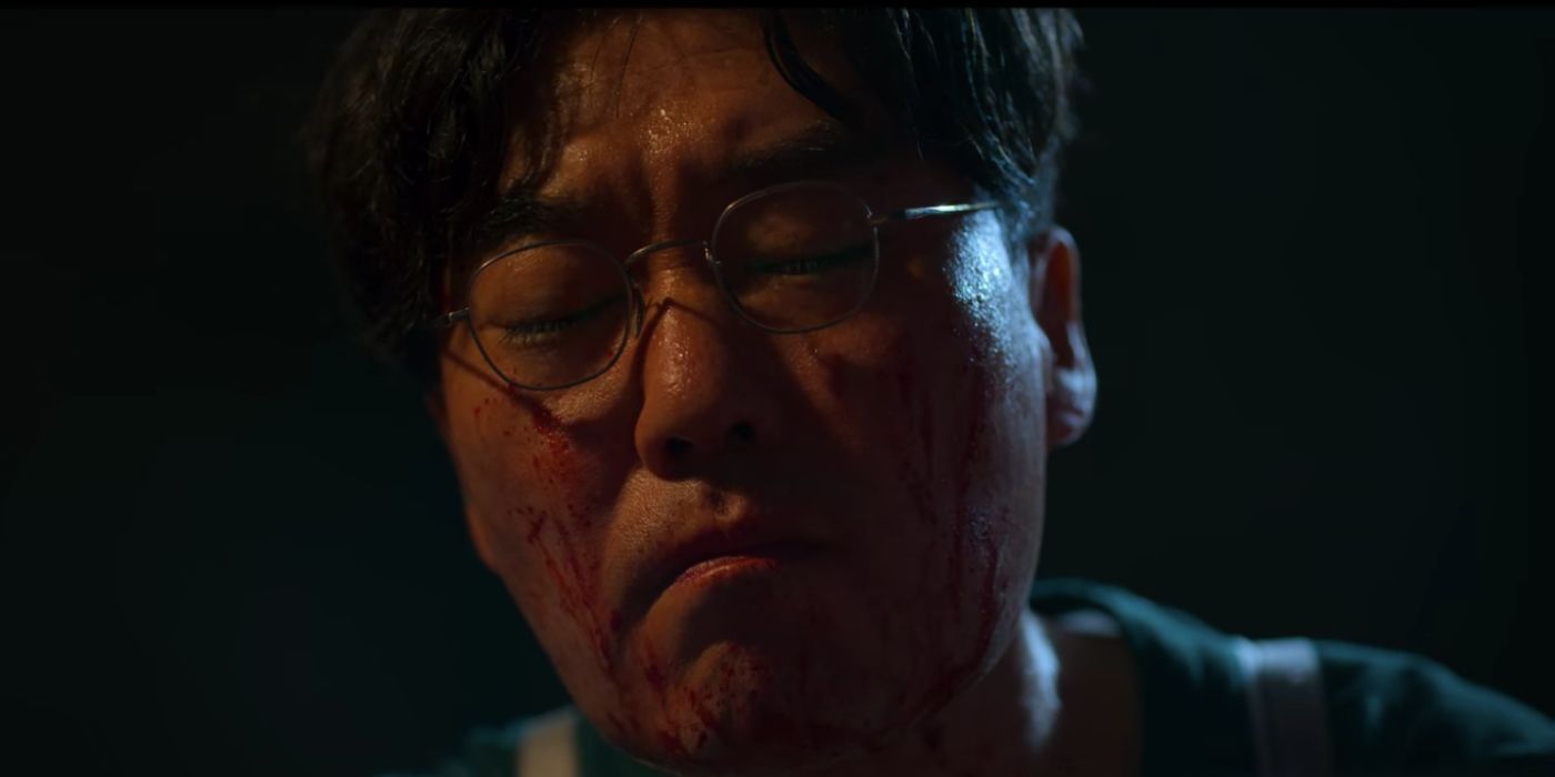 A close-up of Byeong-gi's bloody face in Squid Game.