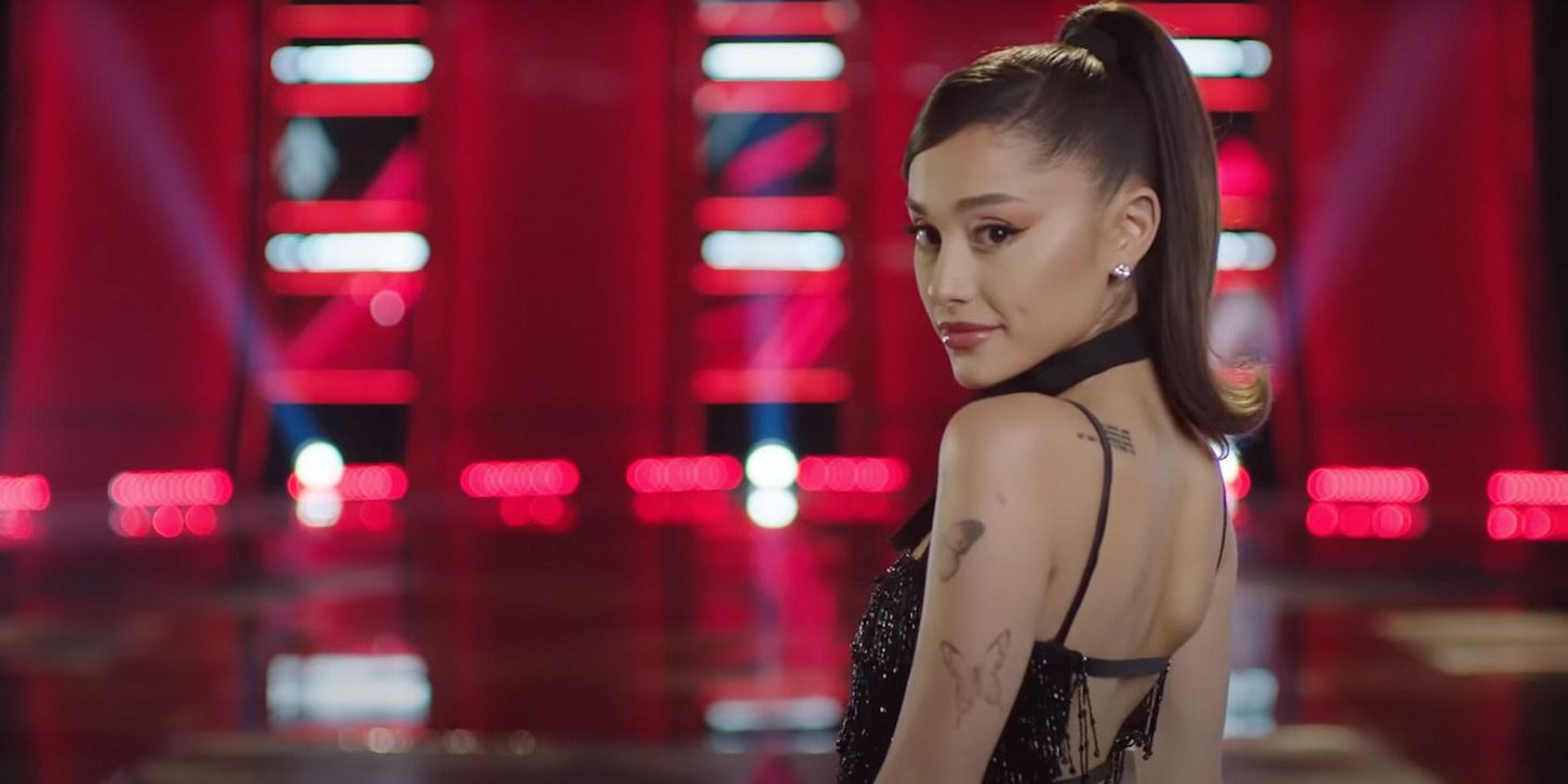 Ariana Grande on The Voice looking over her shoulder.