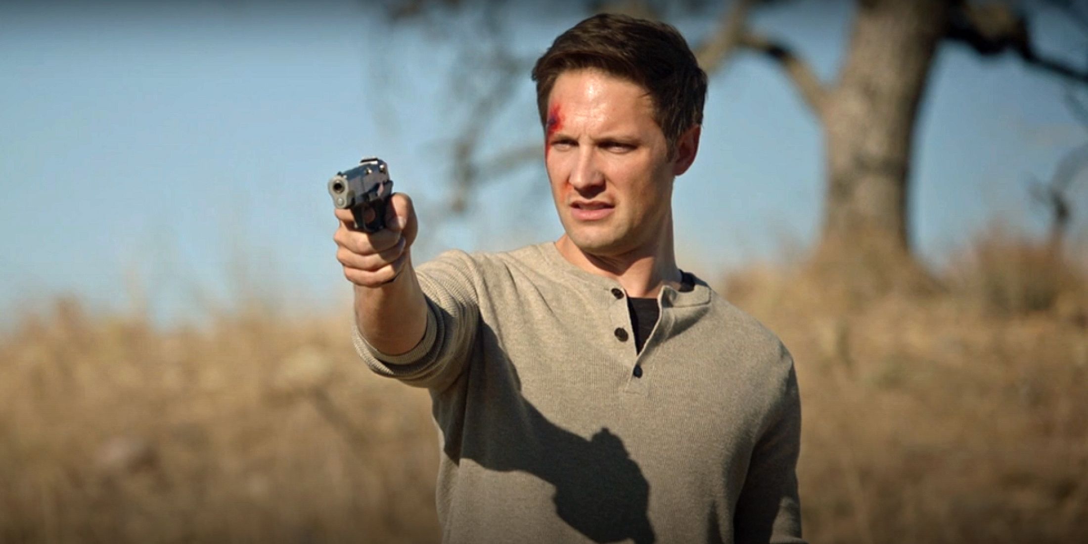 Caleb Wright pointing at gun at Lucy in The Rookie.