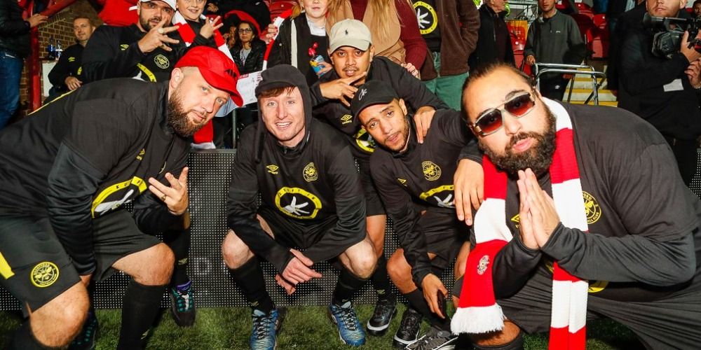 Cast of People Just Do Nothing with Kurupt FM Brentford FC kit on