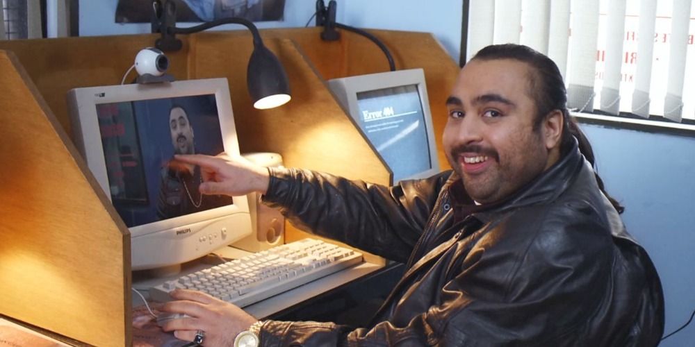 Chabuddy G at his computer in People Just Do Nothing