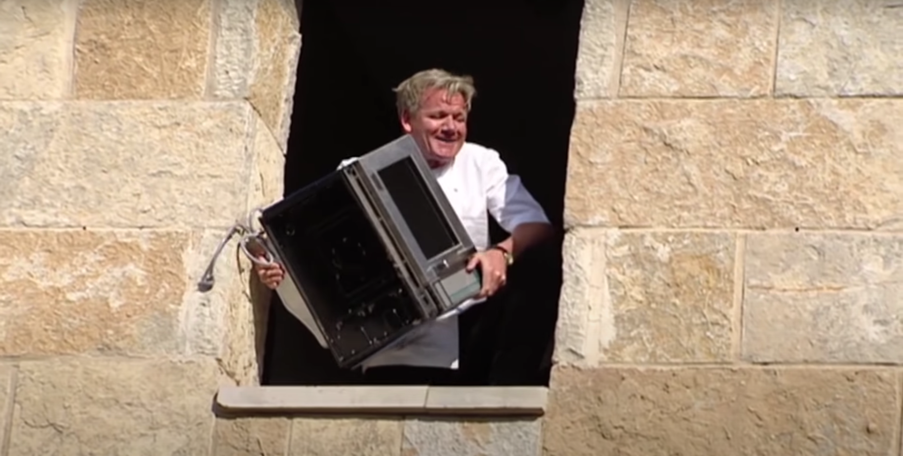 Gordon Ramsay prepares to throw 'Chef Mike' out the window.