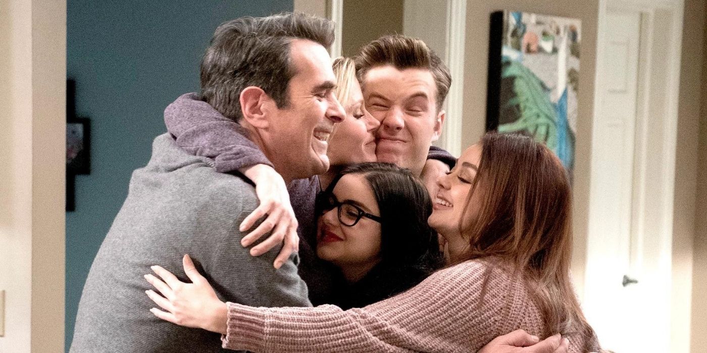 Phil, Claire, Luke, Alex and Haley hugging on Modern Family