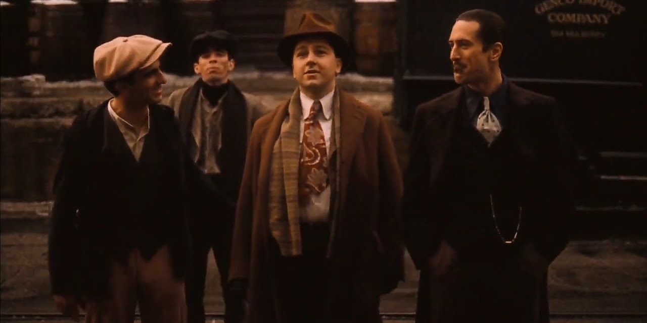 Younger versions of Clemenza and Vito on the streets of Hell's Kitchen, Manhattan in The Godfather