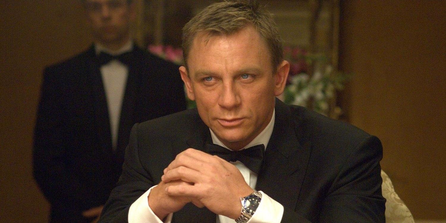 James Bond sits at a poker table in Casino Royale.