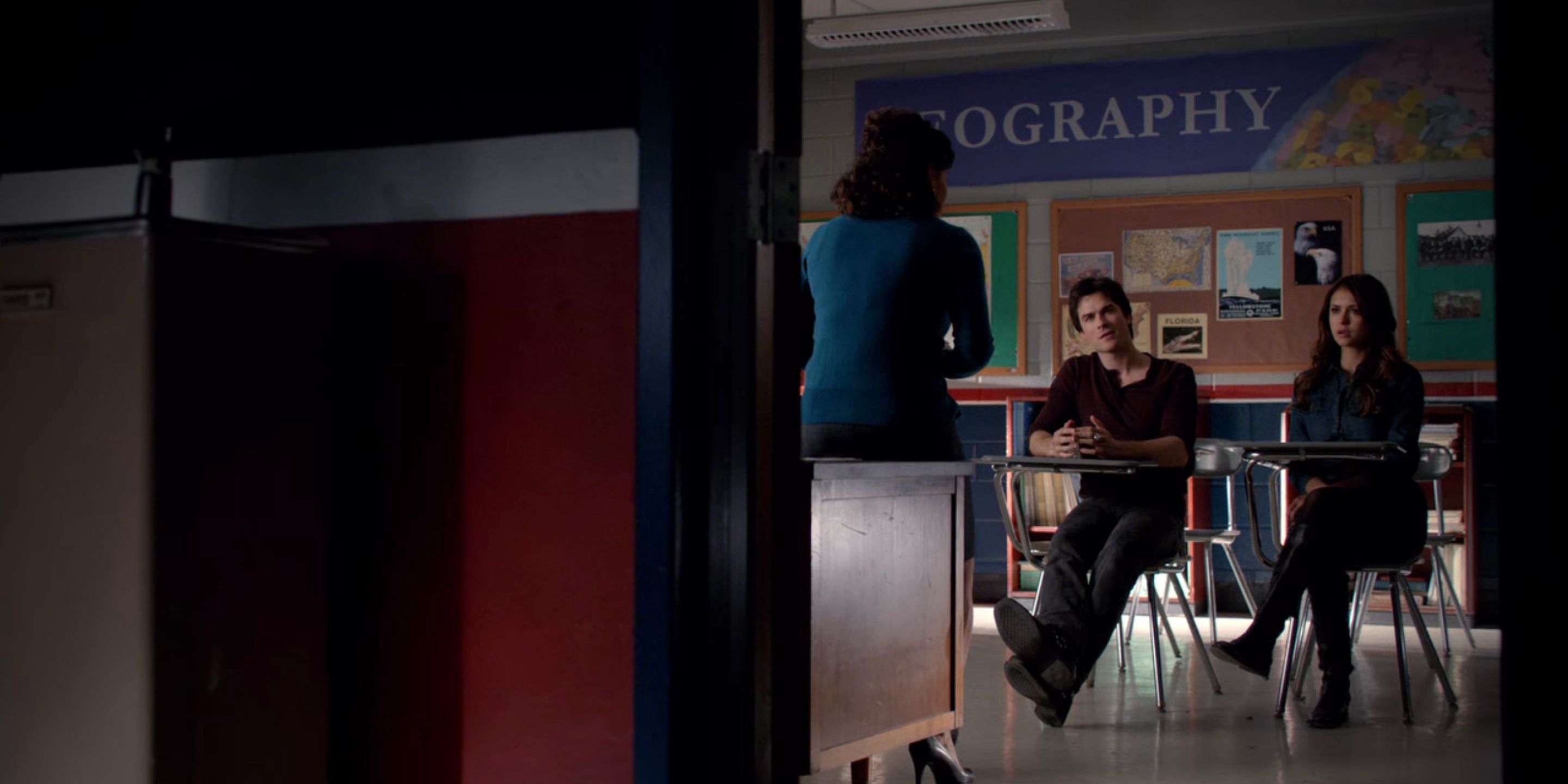 Damon and Elena at Jeremy's parent teacher conference in The Vampire Diaries..