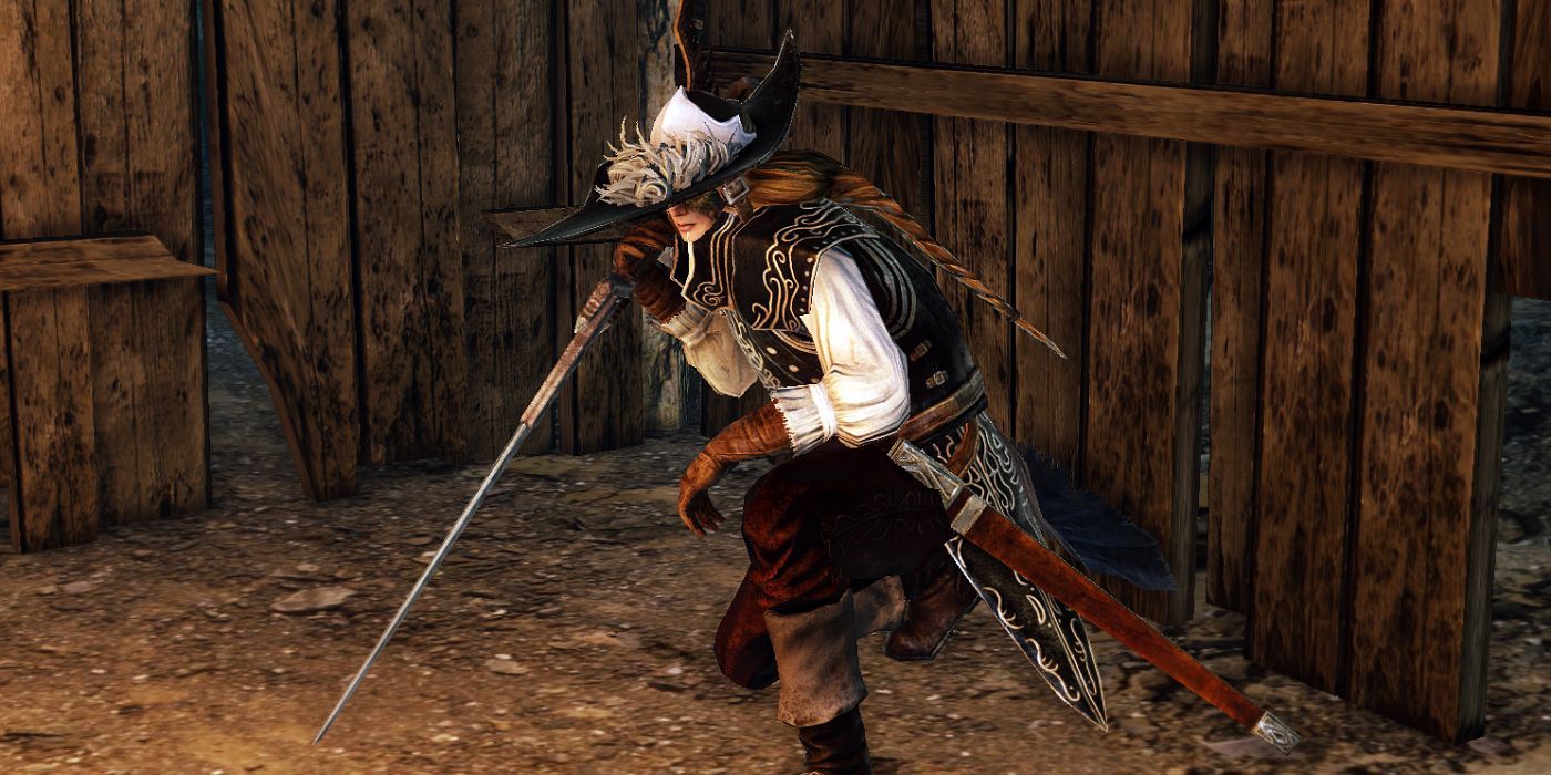 Lucatiel of Mirrah crouches in hiding with a sword in Dark Souls 2.