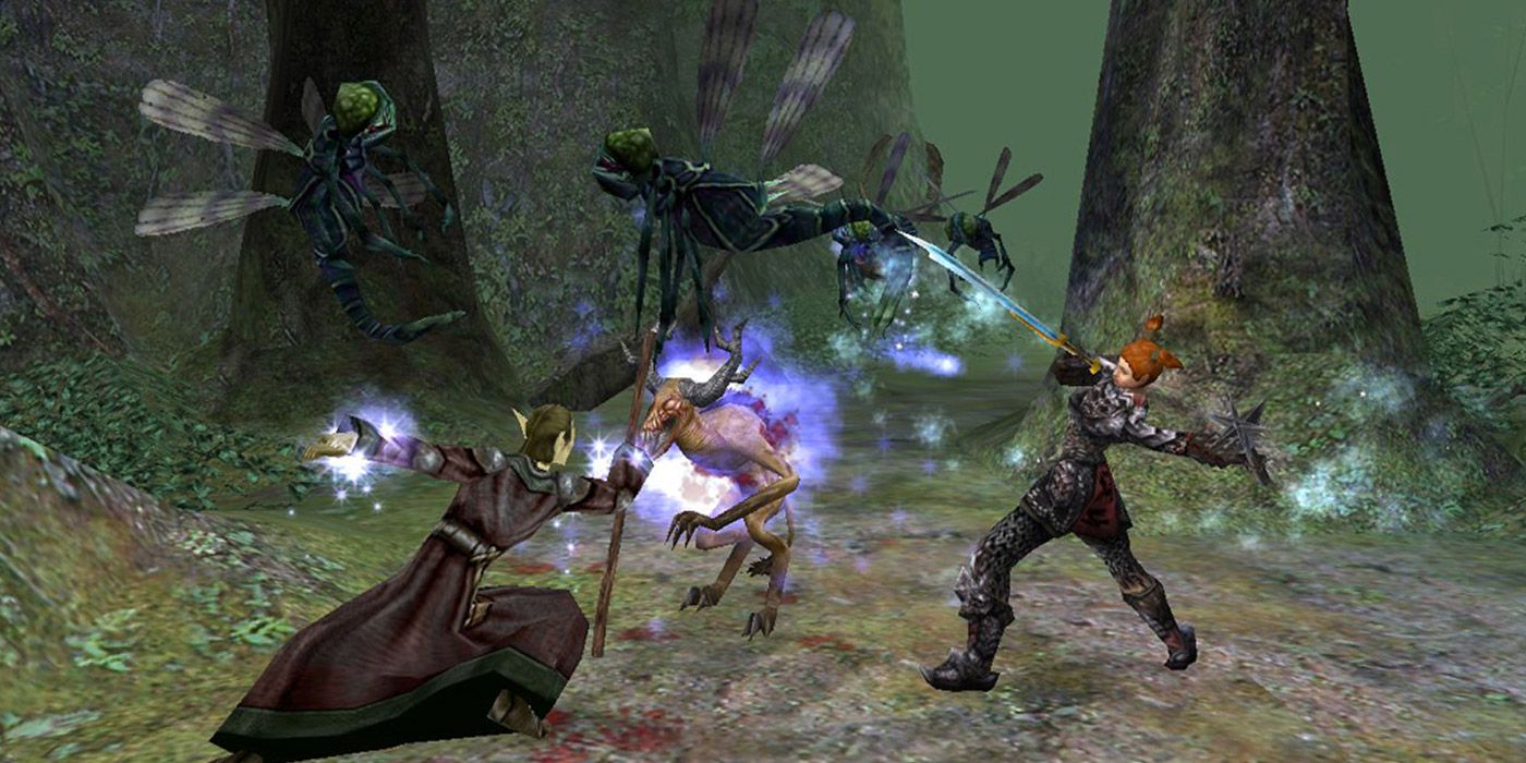 Two heroes battle giant flies in Dungeon Siege II